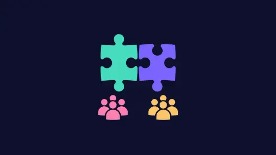Two colored puzzle pieces joining above two small community groups