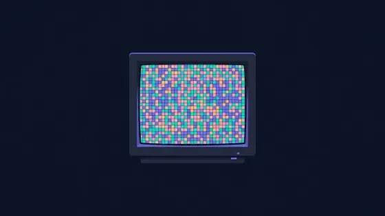 Old computer monitor showing a mosaic of tiny colorful pixel blocks