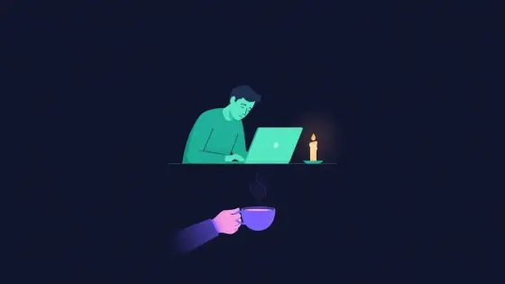 Tired figure at a laptop while another brings a cup of tea