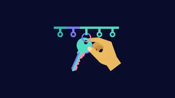 Keys hanging on hooks with one being removed by a hand